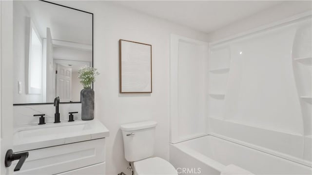 full bathroom with bathing tub / shower combination, toilet, and vanity