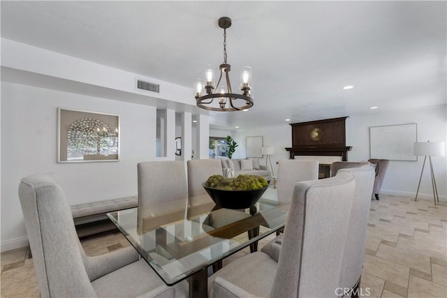 dining space with recessed lighting, visible vents, baseboards, and a chandelier