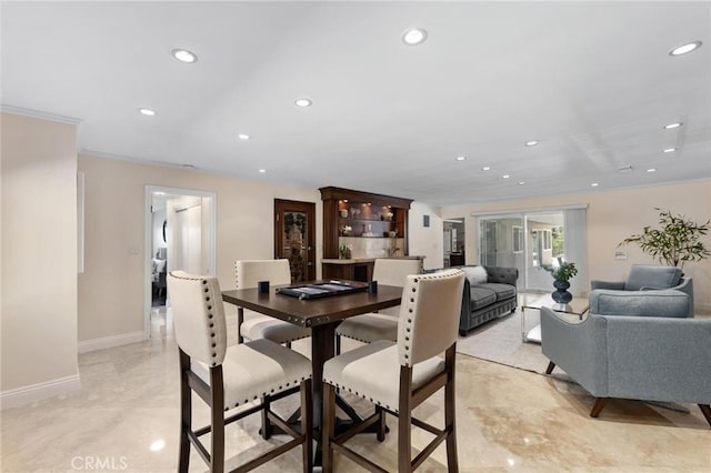 dining area with recessed lighting and baseboards