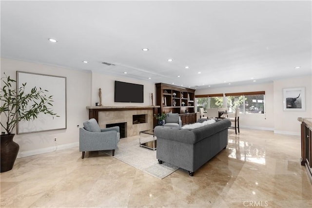 living room with baseboards, visible vents, marble finish floor, and a premium fireplace