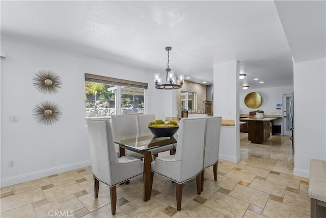 dining room featuring a notable chandelier, recessed lighting, and baseboards