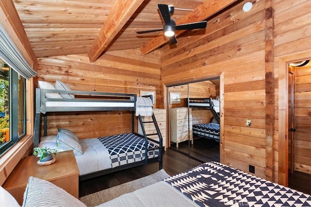 bedroom featuring wood ceiling, vaulted ceiling with beams, wood finished floors, and wood walls