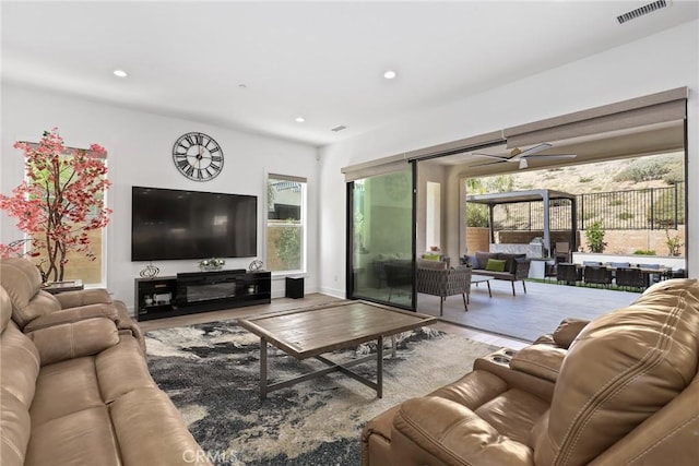 20535 W Bluebird Ct, Porter Ranch, CA 91326 - living area with healthy amount of natural light, recessed lighting, wood finished floors, and a ceiling fan