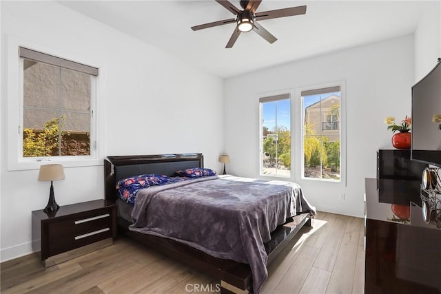 20535 W Bluebird Ct, Porter Ranch, CA 91326 - bedroom featuring light wood-type flooring, ceiling fan, and baseboards