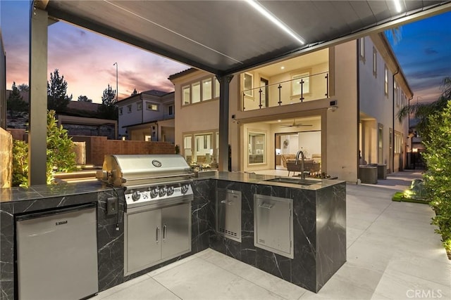 20535 W Bluebird Ct, Porter Ranch, CA 91326 - view of patio / terrace with a sink, area for grilling, exterior kitchen, a balcony, and fence