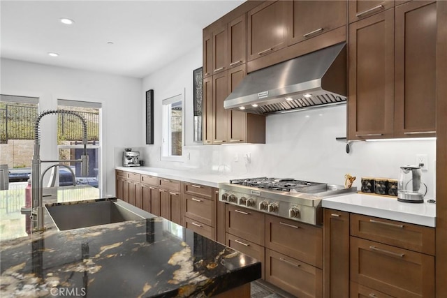 20535 W Bluebird Ct, Porter Ranch, CA 91326 - kitchen with extractor fan, stainless steel gas cooktop, a sink, recessed lighting, and dark stone countertops