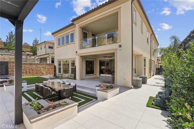 20535 W Bluebird Ct, Porter Ranch, CA 91326 - rear view of house with an outdoor hangout area, stucco siding, a balcony, and a patio area
