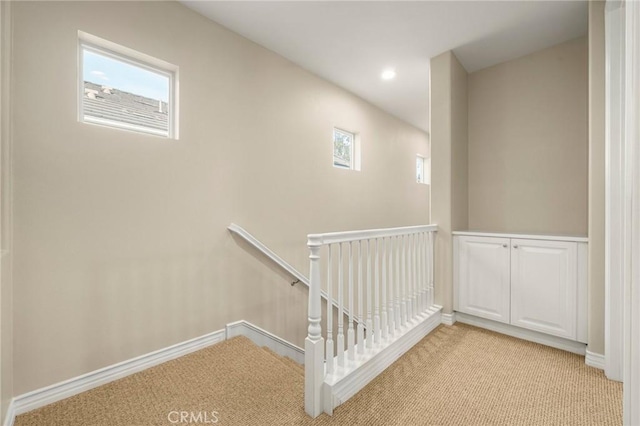 stairs featuring recessed lighting, baseboards, and carpet