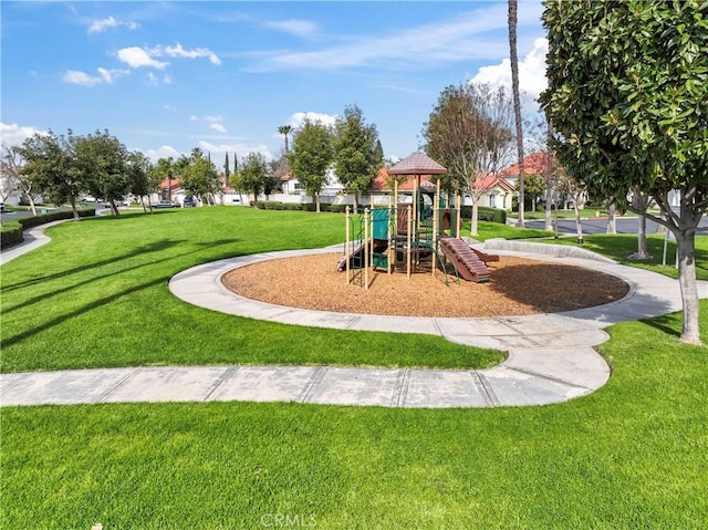 community jungle gym with a lawn