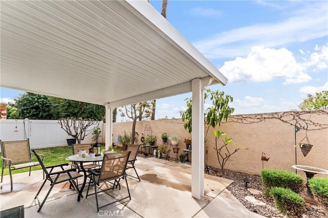 view of patio / terrace featuring outdoor dining area and a fenced backyard