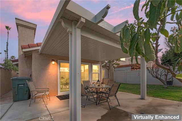 view of patio / terrace with outdoor dining space and fence