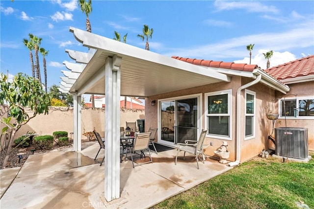 view of patio / terrace featuring cooling unit and fence