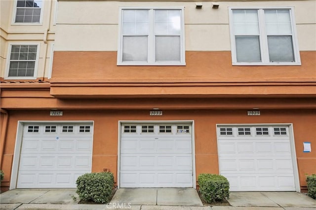 garage with concrete driveway