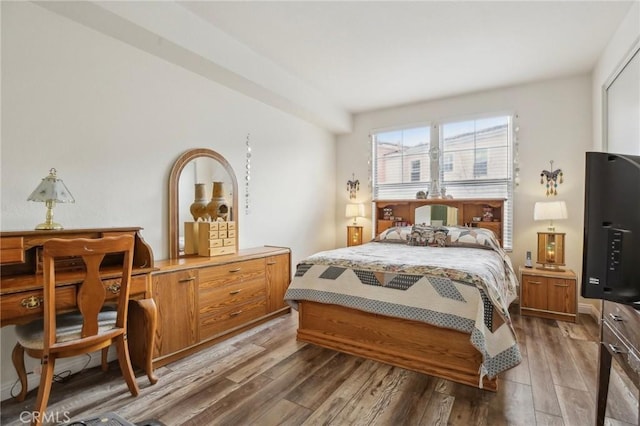 bedroom with wood finished floors