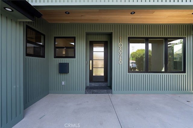 doorway to property with board and batten siding