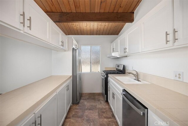 kitchen featuring wood ceiling, beam ceiling, stainless steel appliances, white cabinetry, and a sink