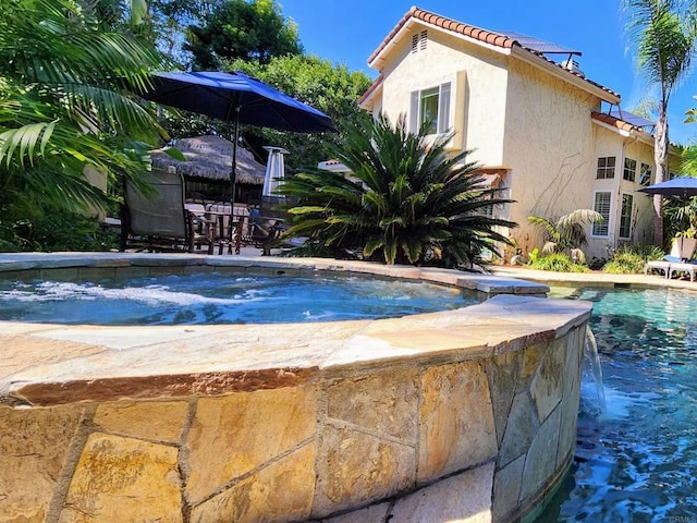 outdoor pool featuring a patio