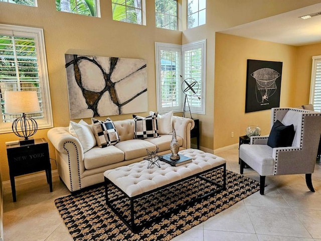 tiled living area with visible vents and baseboards