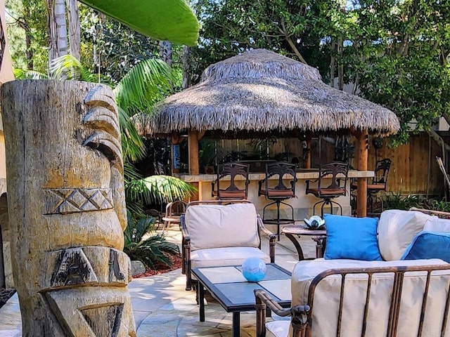 view of patio / terrace featuring an outdoor hangout area and outdoor dry bar