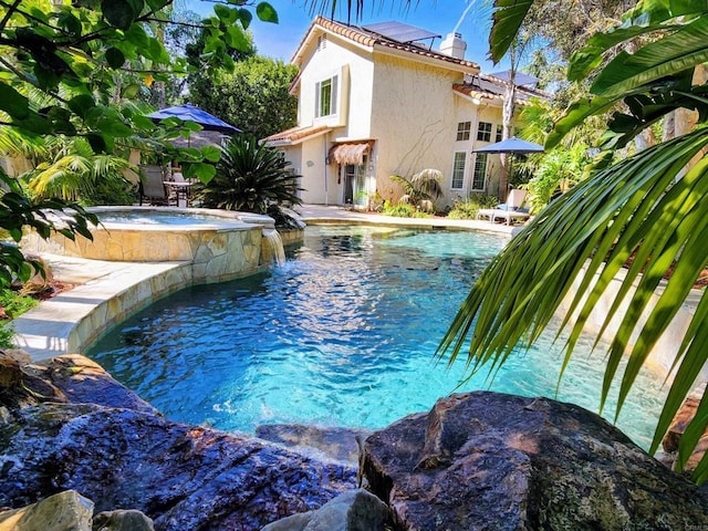 pool with an in ground hot tub