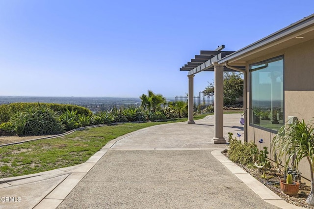 view of patio / terrace featuring fence