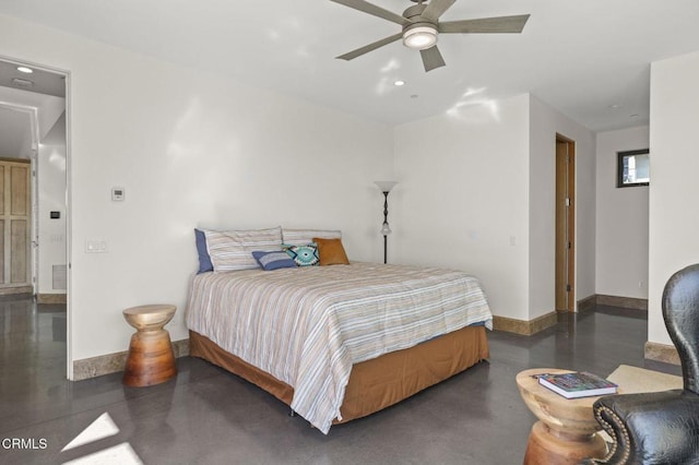 bedroom featuring a ceiling fan, visible vents, finished concrete flooring, and baseboards