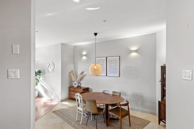 dining area featuring baseboards