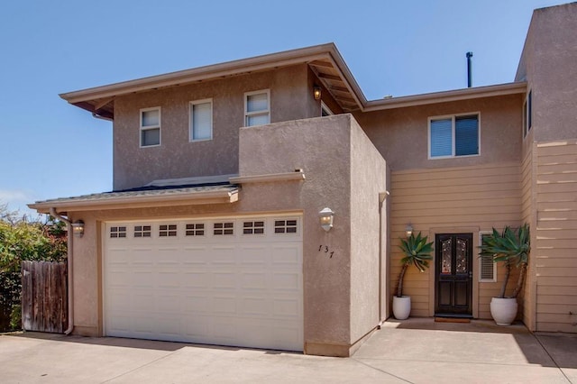 137 Jupiter St, Encinitas, CA 92024 - view of front of property featuring stucco siding, driveway, and a garage
