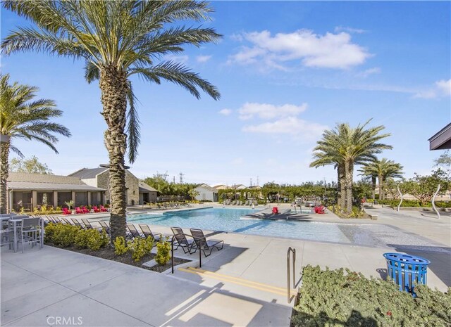 community pool featuring a patio area