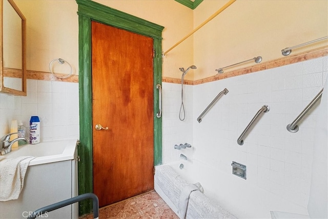 full bathroom featuring vanity, shower / bathing tub combination, tile walls, and tile patterned floors