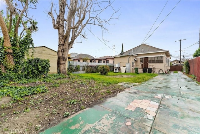 back of property featuring stucco siding and fence private yard