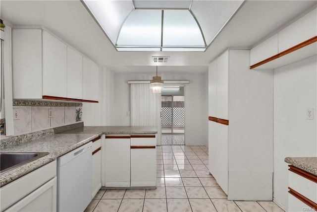 kitchen featuring a skylight, visible vents, white cabinets, and white dishwasher