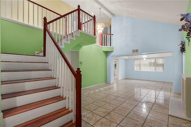 stairs featuring tile patterned floors, visible vents, beam ceiling, high vaulted ceiling, and an inviting chandelier