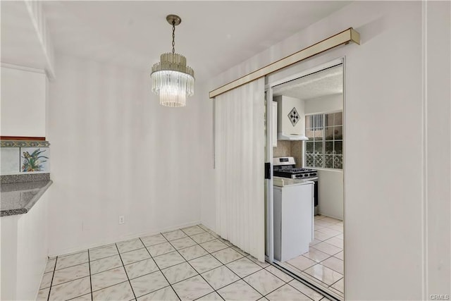 dining room featuring light tile patterned floors and an inviting chandelier