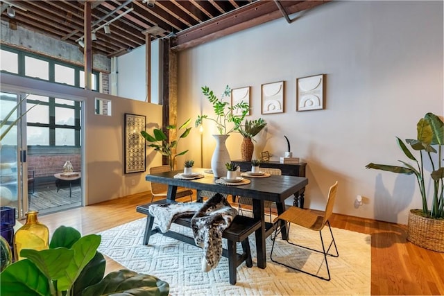 dining area with wood finished floors