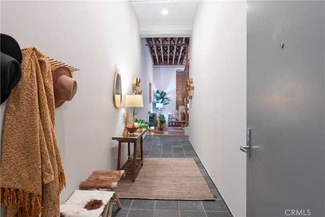 corridor featuring recessed lighting and dark tile patterned flooring