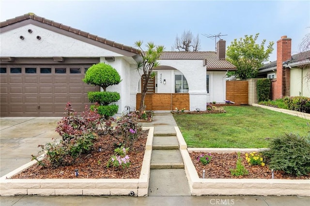 mediterranean / spanish-style home with stucco siding, an attached garage, driveway, and a tiled roof