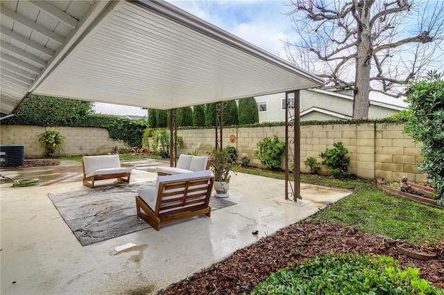 view of patio / terrace with central AC unit, outdoor lounge area, and a fenced backyard