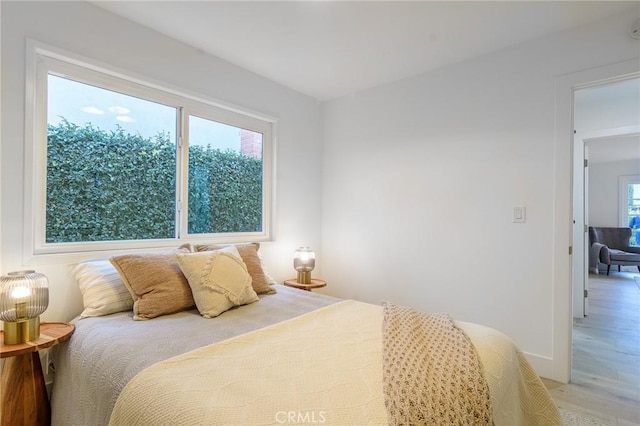 bedroom with light wood-style flooring