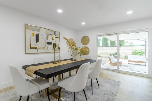 dining area with recessed lighting, baseboards, and light wood-style floors