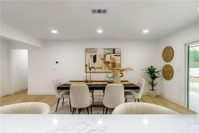 dining room featuring visible vents, recessed lighting, baseboards, and wood finished floors