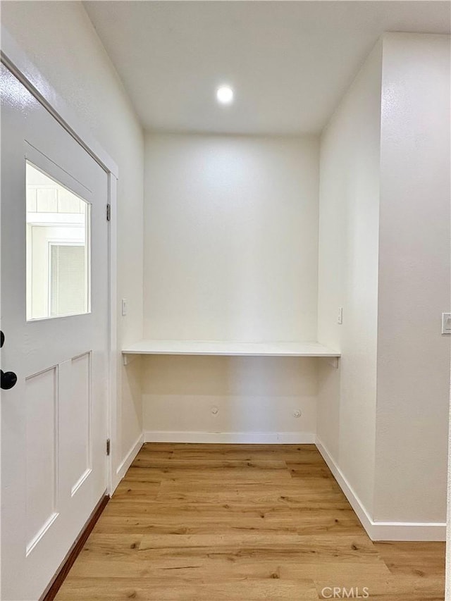 interior space with recessed lighting, baseboards, and light wood-style floors