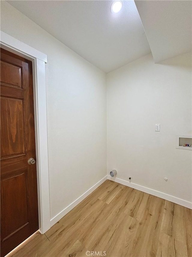 laundry area with hookup for a washing machine, light wood-style flooring, baseboards, and gas dryer hookup