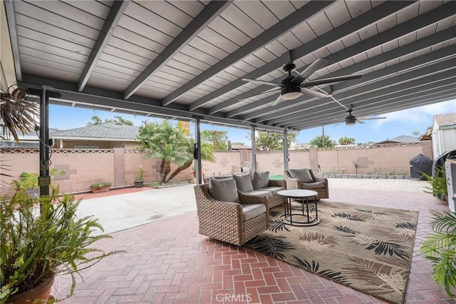 view of patio with outdoor lounge area, a fenced backyard, and ceiling fan