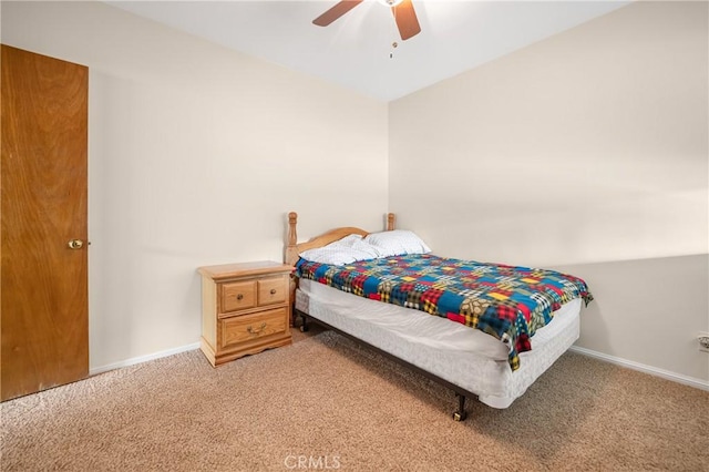 carpeted bedroom with baseboards and ceiling fan