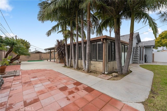 exterior space featuring a patio area and a fenced backyard