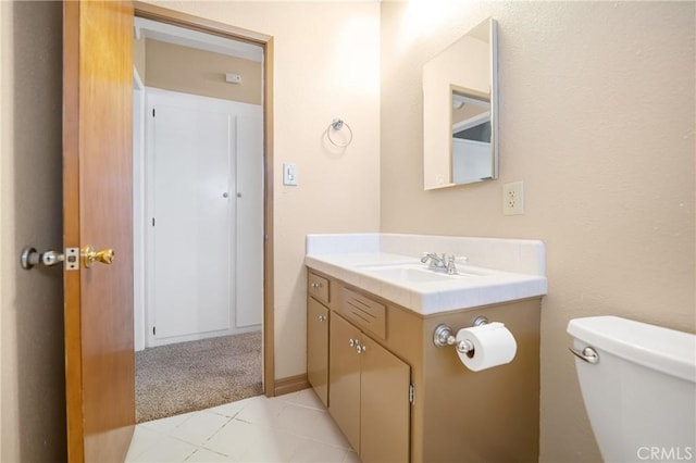 bathroom with toilet and vanity