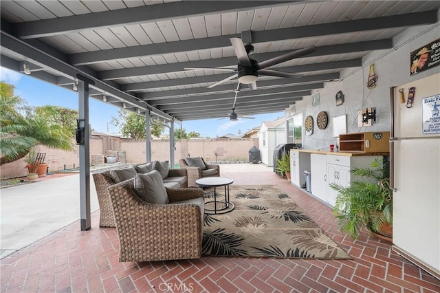 view of patio / terrace featuring a ceiling fan and fence