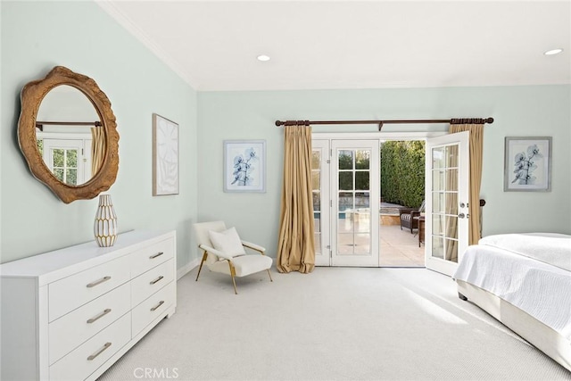 bedroom with access to exterior, recessed lighting, french doors, and light colored carpet