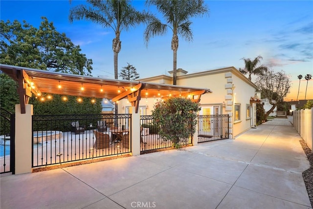 view of front of property with stucco siding and fence